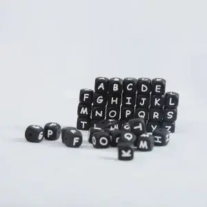 Solid black letter silicone beads