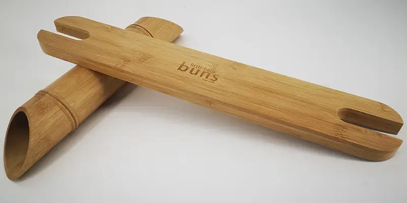 Bamboo footrests with custom laser-engraved brand logo