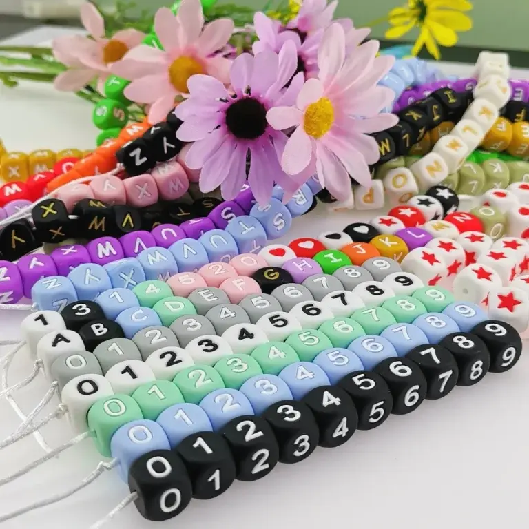 Number silicone beads arranged with flowers for crafting